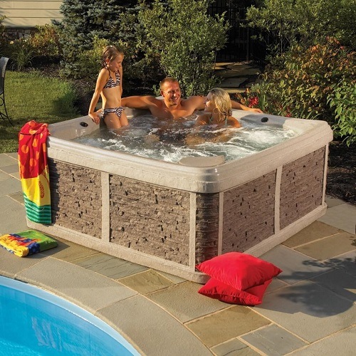 family in an energy efficient hot tub
